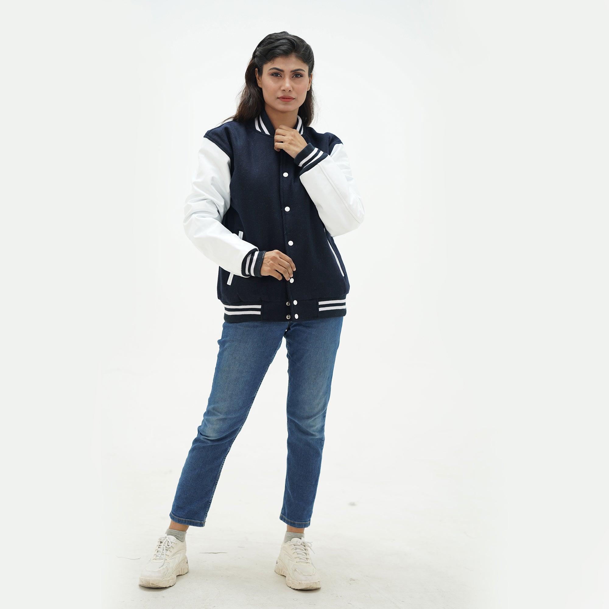 Dark blue athletic jacket women close-up - showing ribbed collar construction with navy striped trim and premium snap button hardware