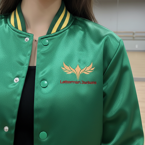 Green letterman jacket with gold emblem and text on a blurred indoor background