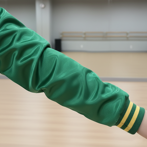 Green arm sleeve with yellow stripe on a blurred indoor background