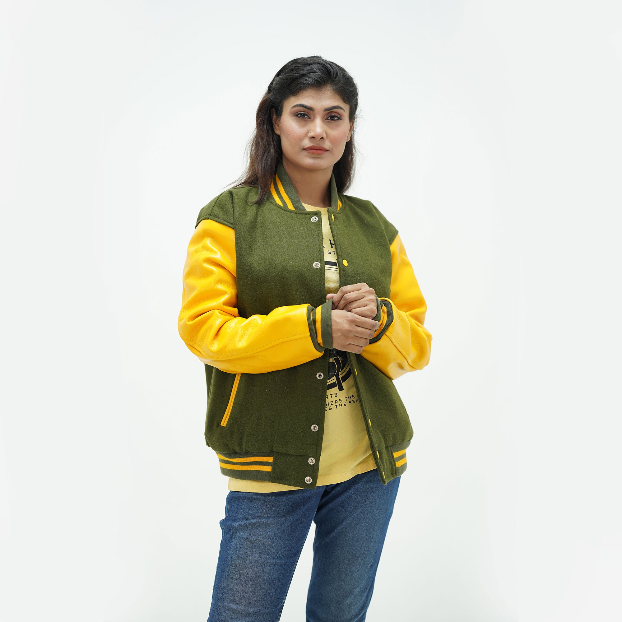 Women's green baseball jacket side angle - highlighting feminine tailored fit with genuine leather sleeves and dark green ribbed cuffs