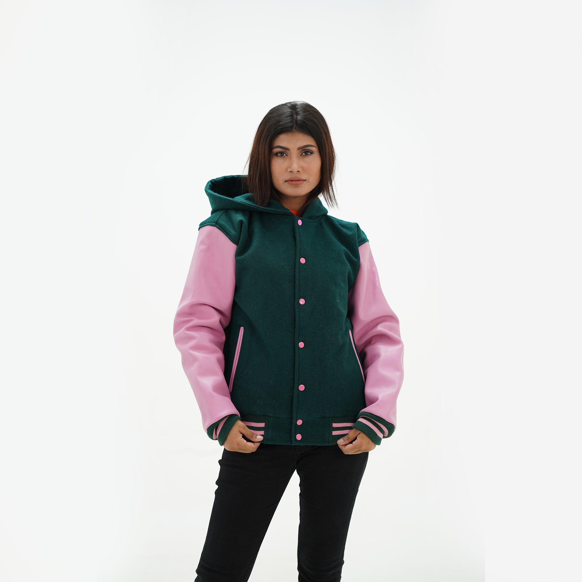 Detail of white leather sleeve with green and pink striped ribbed knit cuffs on hooded baseball jacket