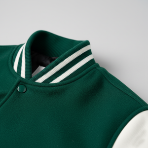 Green jacket with white striped collar on a light gray background
