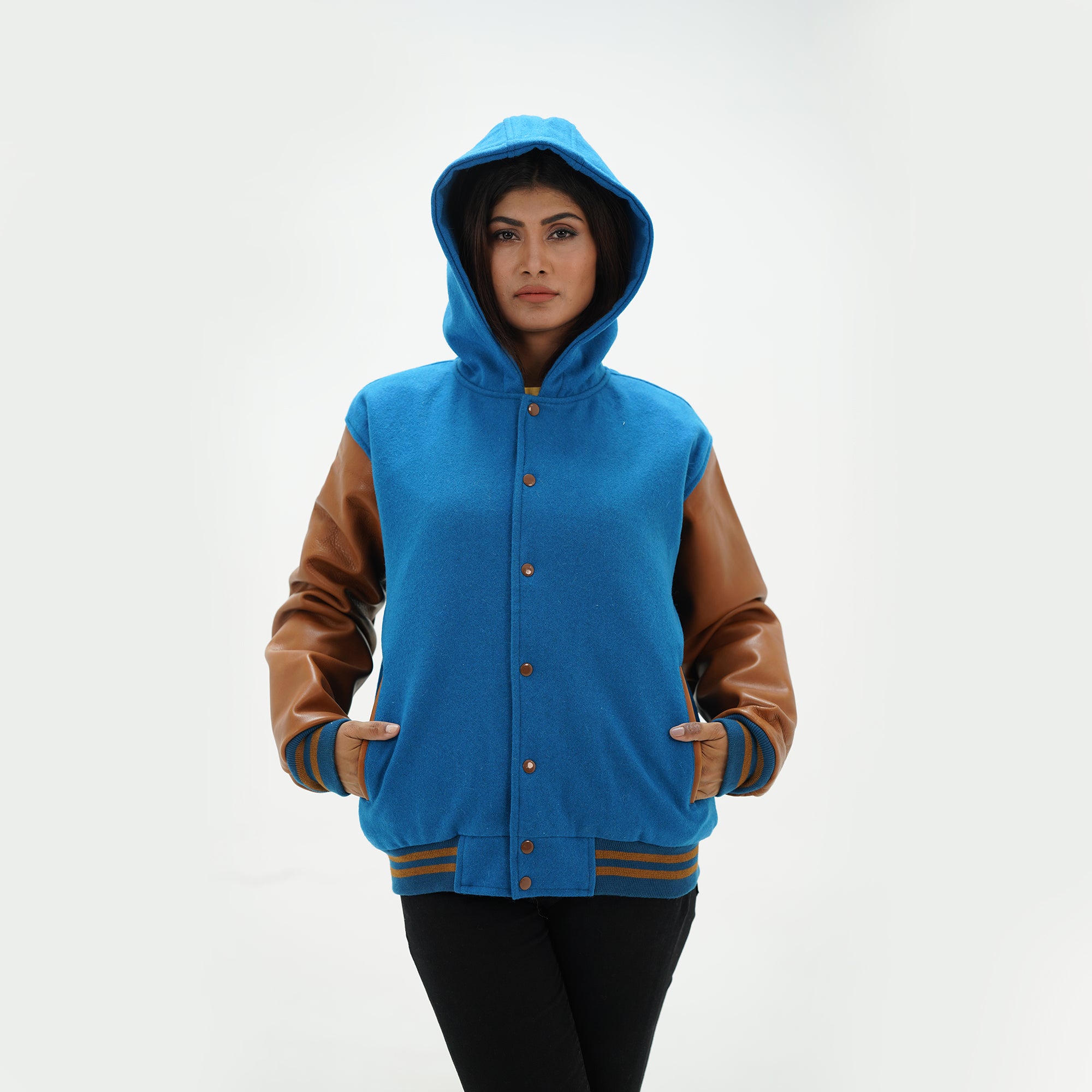 Close-up of girls hooded letterman jacket drawstring hood and leather sleeve contrast detail