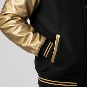 Black jacket with gold sleeves and accents on a light gray background