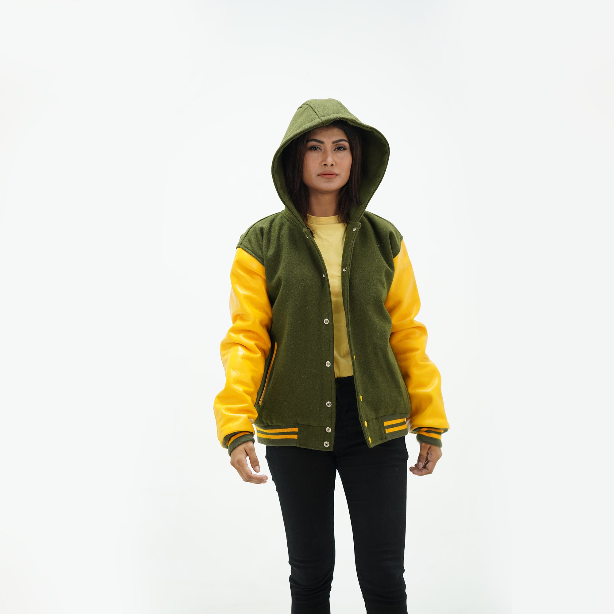 Three-quarter view of green and yellow baseball jacket with adjustable hood and yellow leather sleeves with ribbed trim