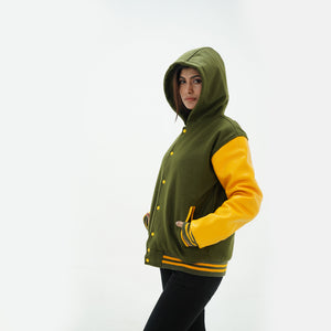 Detail shot of white leather sleeve with green yellow striped ribbed knit cuffs on hooded varsity jacket