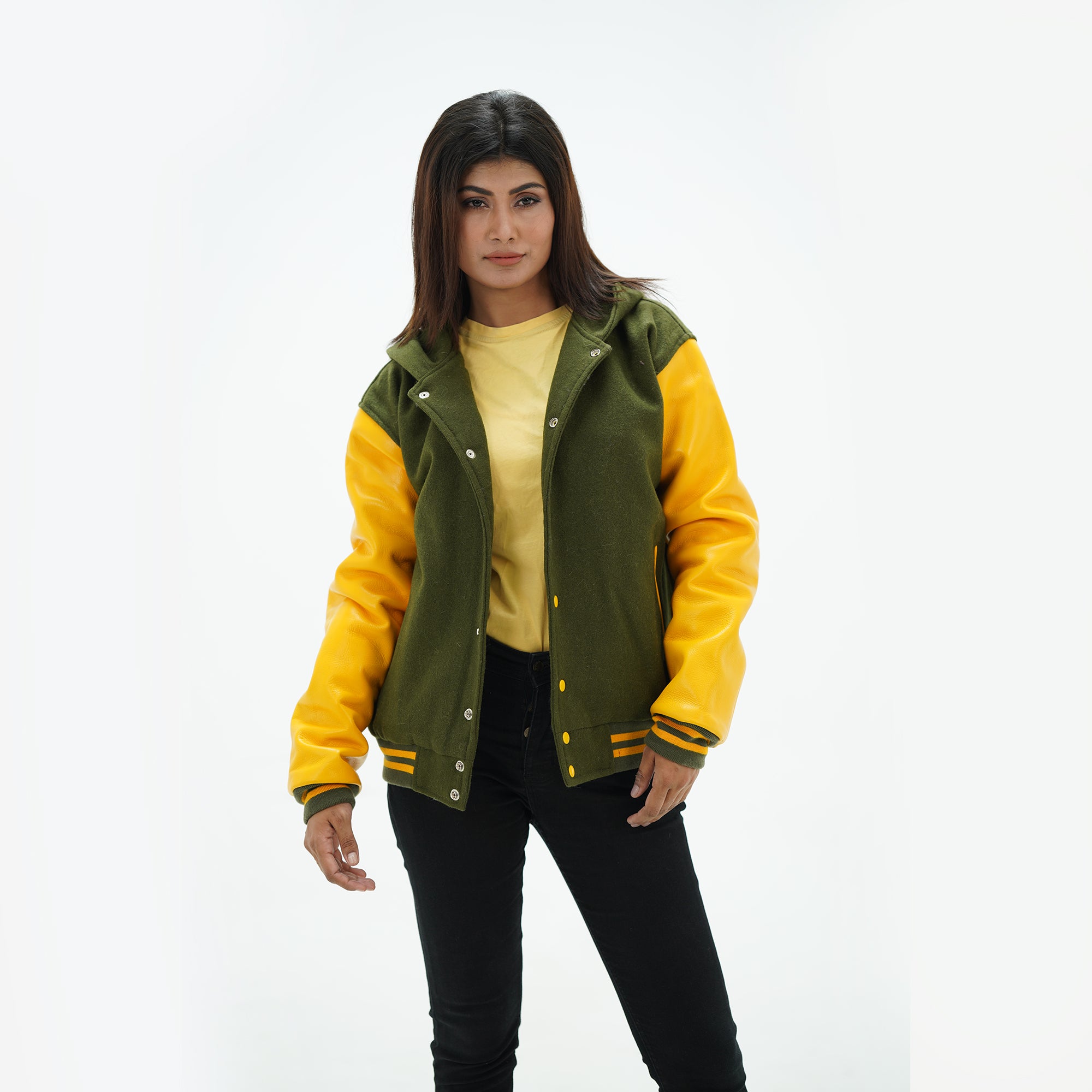 Three-quarter view of green and yellow baseball jacket with adjustable hood and white leather sleeves with ribbed trim