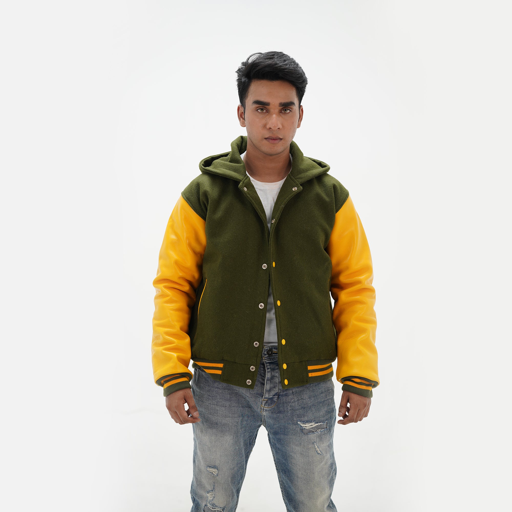Detailed view of green and yellow hooded coach jacket combining classic varsity tradition with modern hooded design