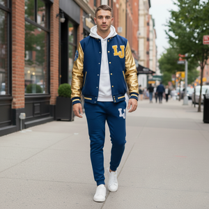 Man wearing a blue and gold varsity jacket with 'LJ' on a city street.