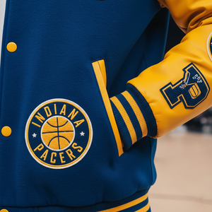 Blue and yellow Indiana Pacers jacket with logo on a blurred background