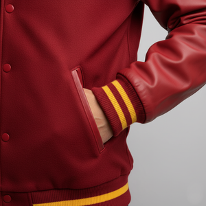 Red varsity jacket with yellow stripes on a gray background