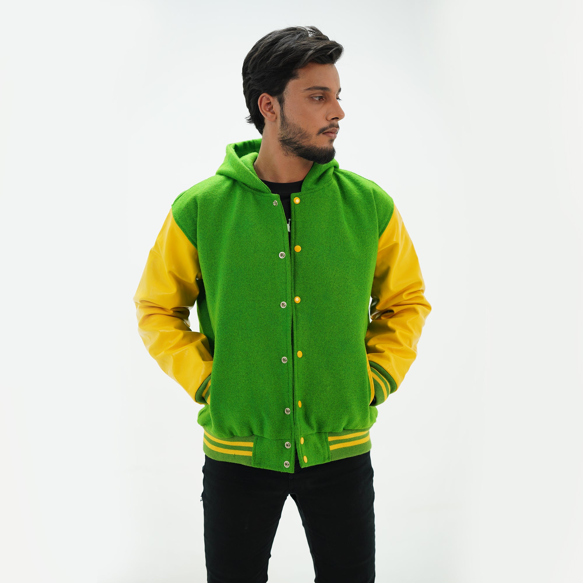 Side angle of men's kelly green hoodie letterman jacket highlighting genuine cowhide yellow leather arms and hooded design