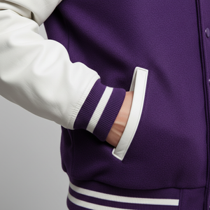 Purple varsity jacket with white trim on a plain background