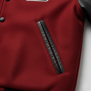 Close-up of a red garment with black leather trim on a white background
