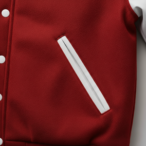 Red jacket with white buttons and a white stripe on a light gray background