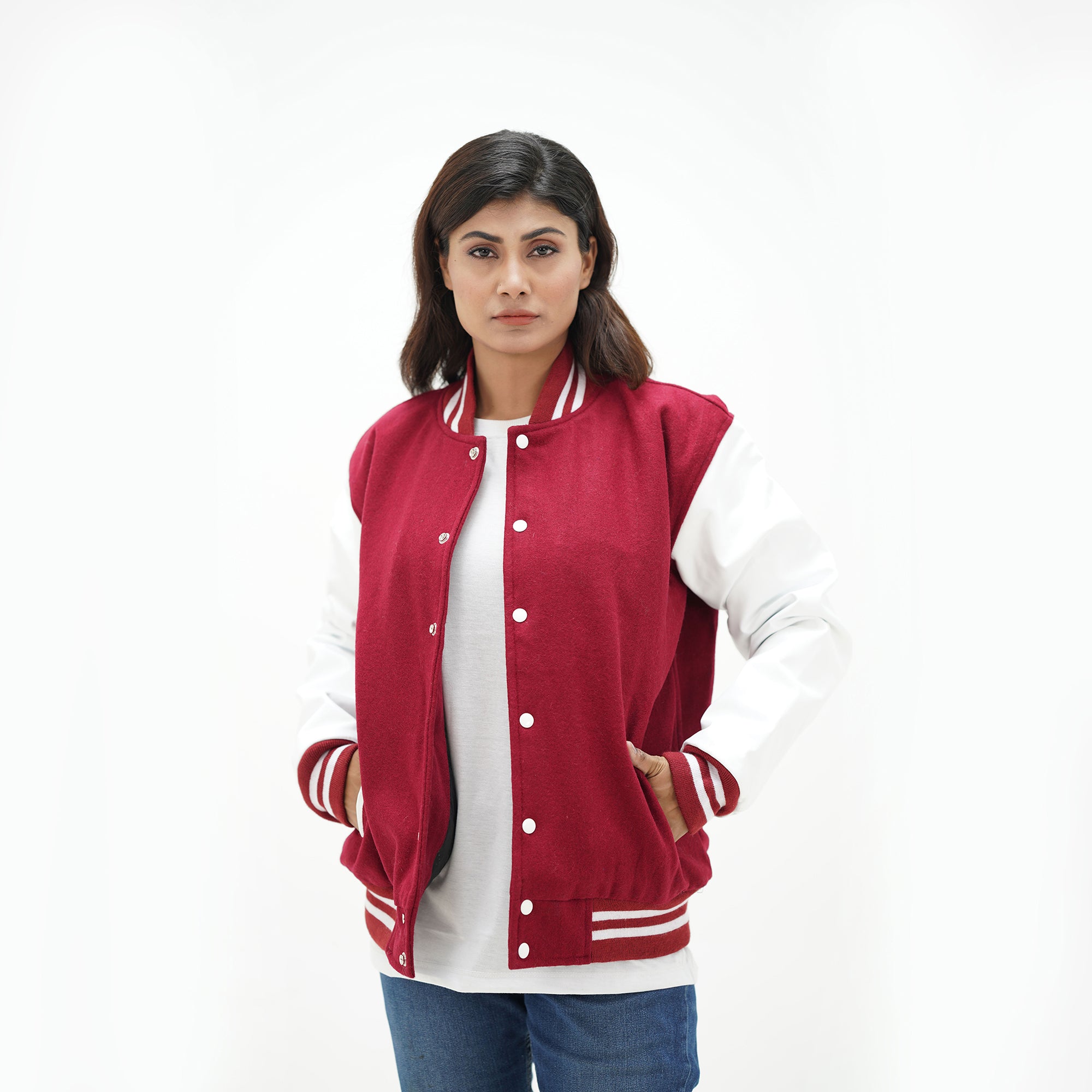 Magenta and white letterman jacket women three-quarter view - showcasing bold color contrast with white leather arms and magenta wool body