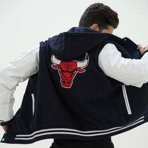 Three quarter view of men Chicago Bulls hooded jacket highlighting premium wool body and genuine leather sleeve materials for NBA fans