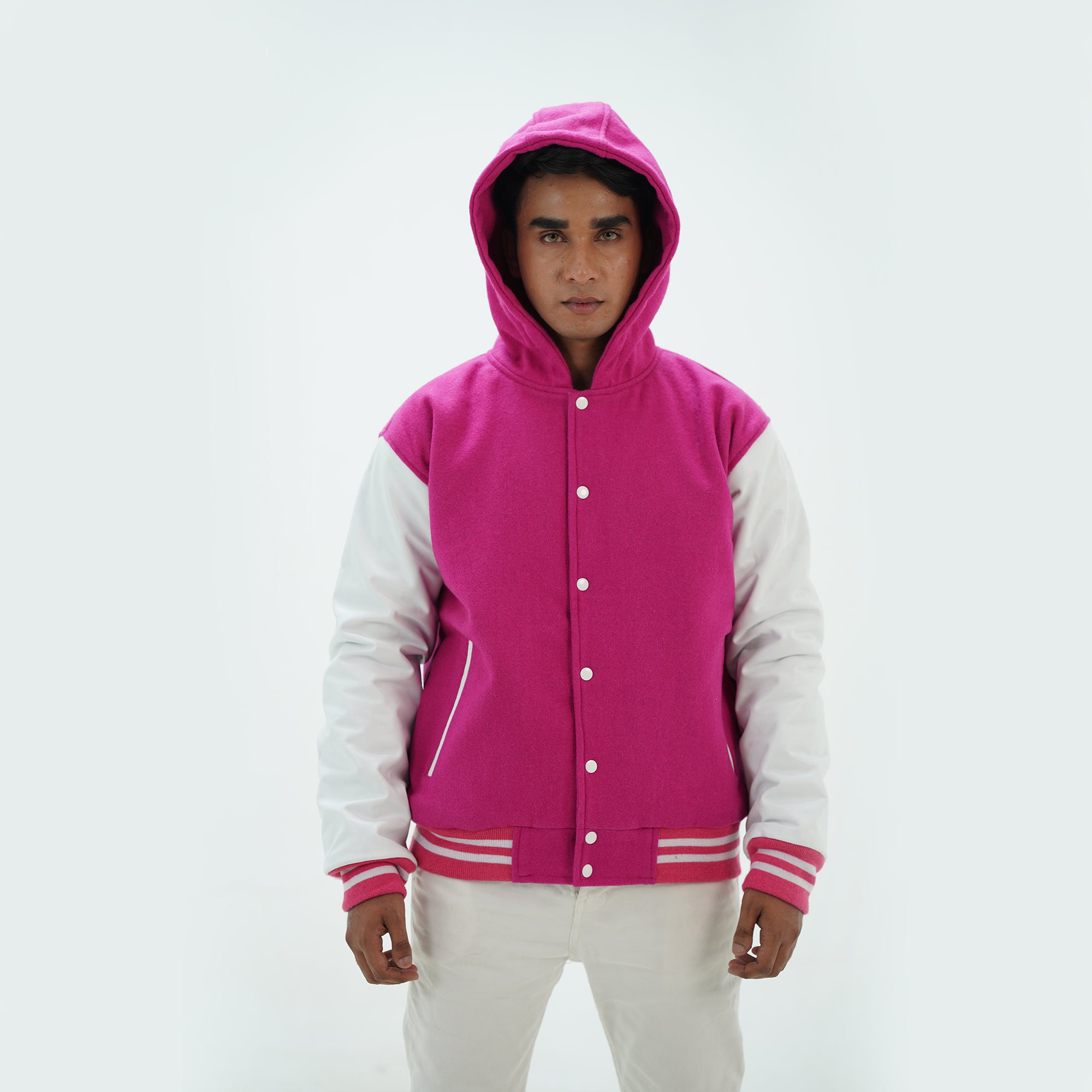 Close-up of men's hooded varsity jacket leather sleeves and pink white color combination detail