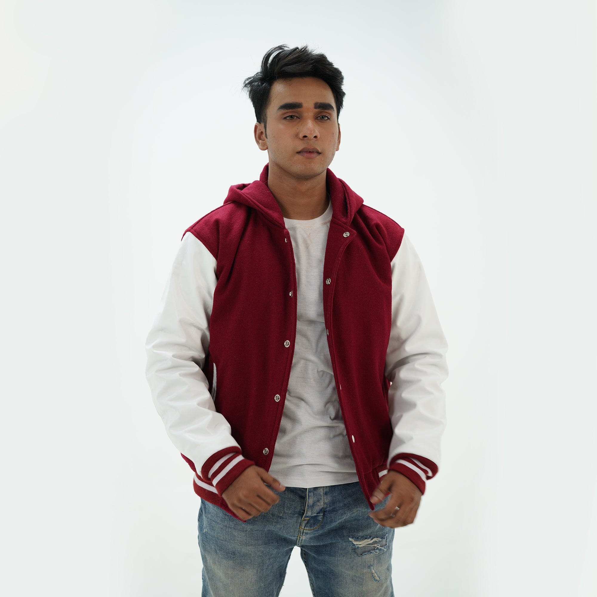 Close-up detail of men's magenta and white letterman hoodie with custom embroidery and premium wool leather materials