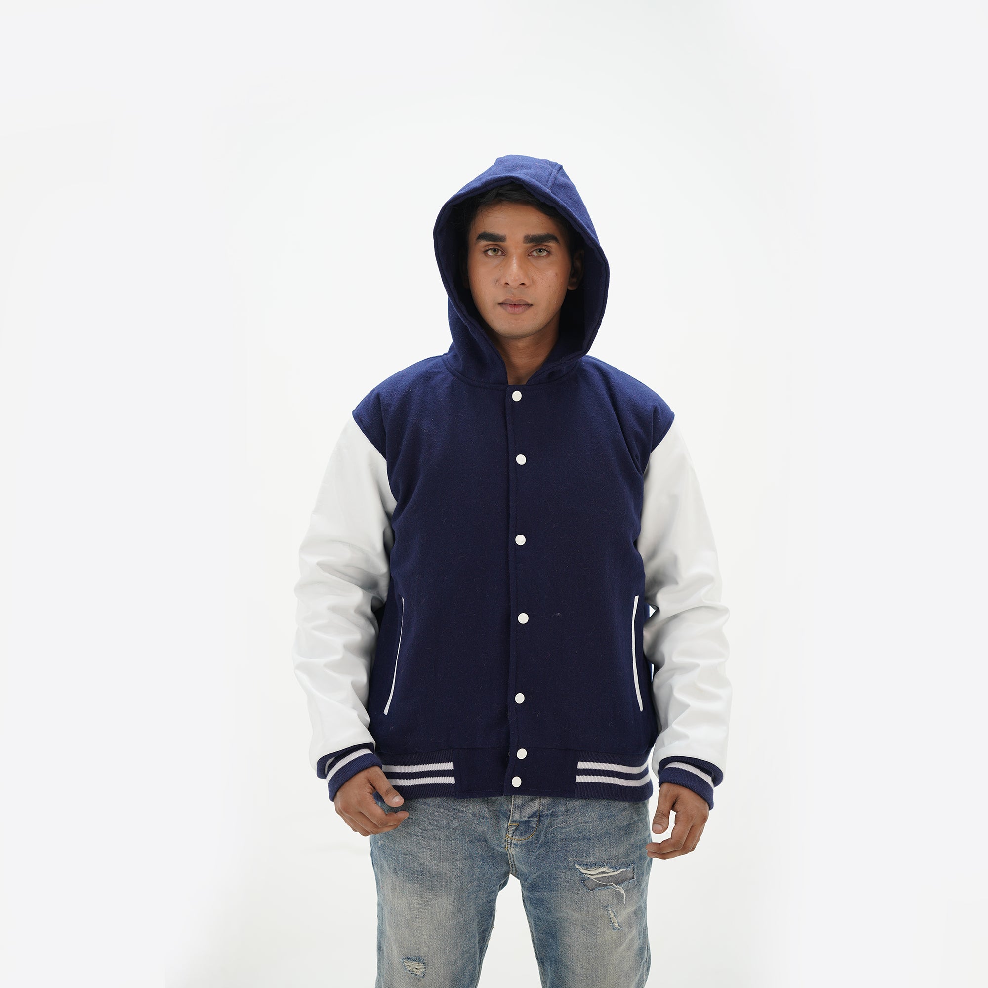 Detailed view of men's navy blue varsity jacket with hood featuring ribbed cuffs and premium wool leather construction