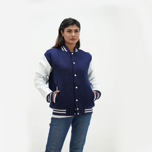Navy athletic jacket women close-up - showing ribbed collar construction with navy striped trim and snap button hardware