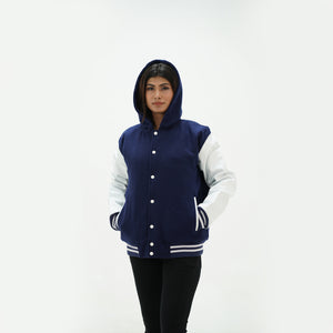 Side angle of women's navy blue varsity hoodie featuring white leather raglan sleeves and red striped ribbed cuffs