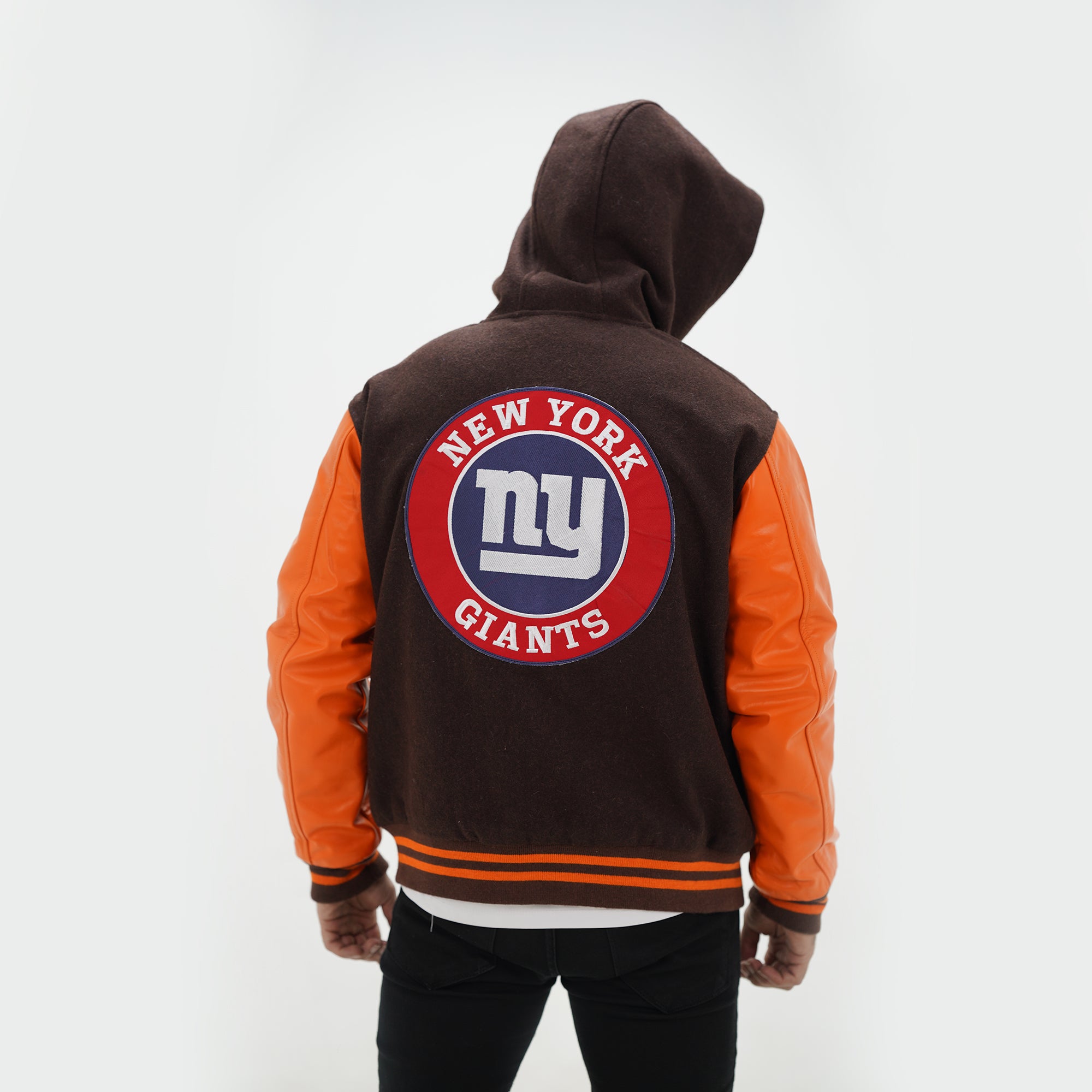 Back view of NY Giants varsity hoodie showing attached hood and championship customization options with brown wool gold leather design