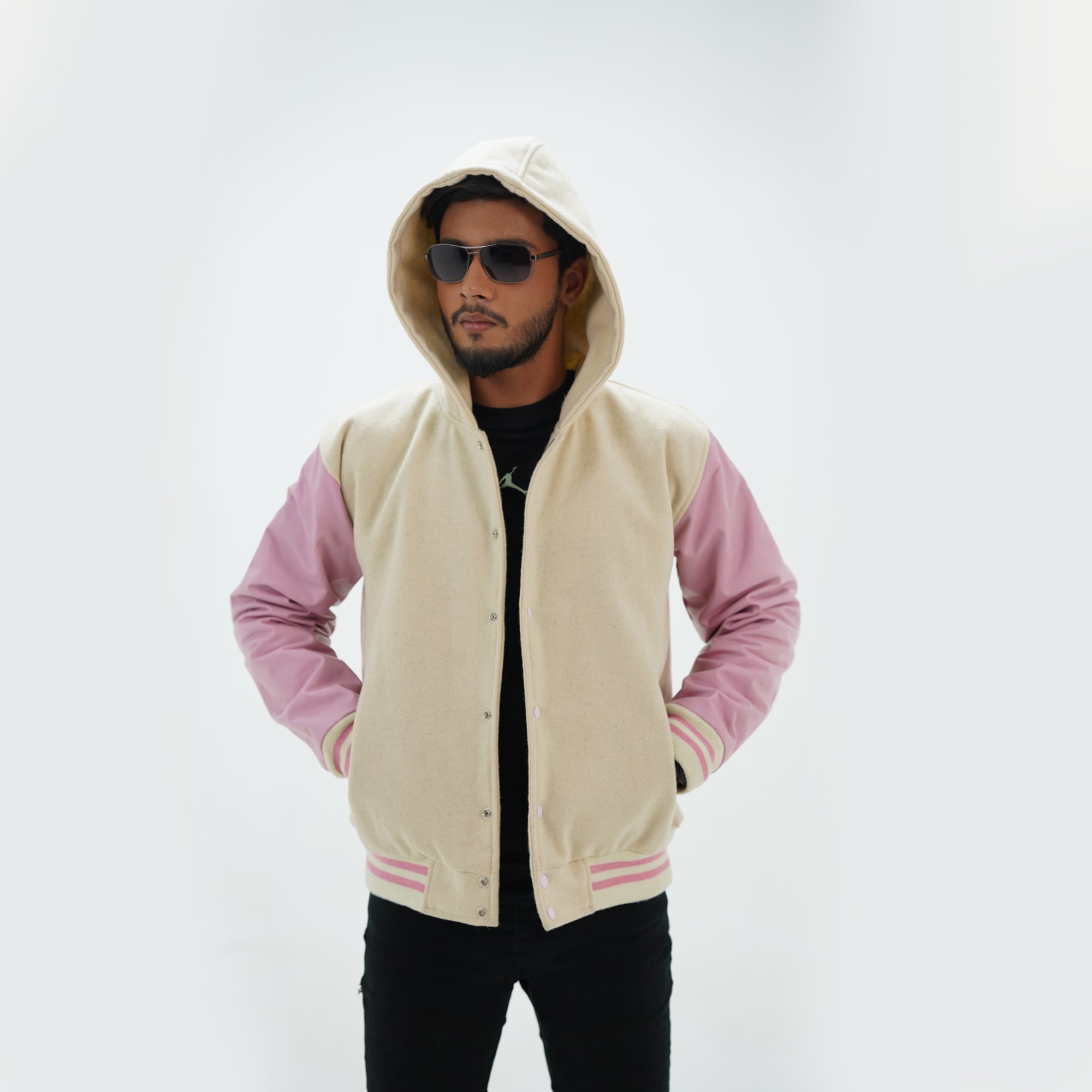 Close-up detail of off white and pink hooded varsity jacket perfect for game days and casual streetwear