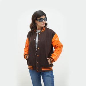 Old gold leather sleeve letterman jacket close-up - showing ribbed collar and cuff construction with brown and gold striped trim