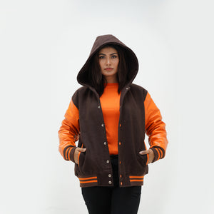 Close-up of adjustable hood and ribbed collar on old gold women's varsity jacket with leather sleeve contrast