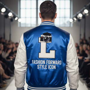 Person wearing a blue and white jacket with text and a camera graphic on the back, walking on a runway.