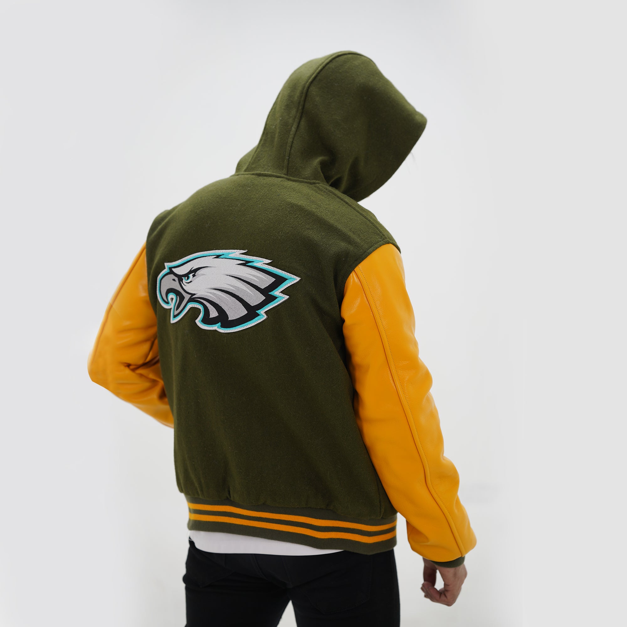Back view of Philly Eagles hooded varsity jacket displaying hood styling and premium wool leather construction in team colors