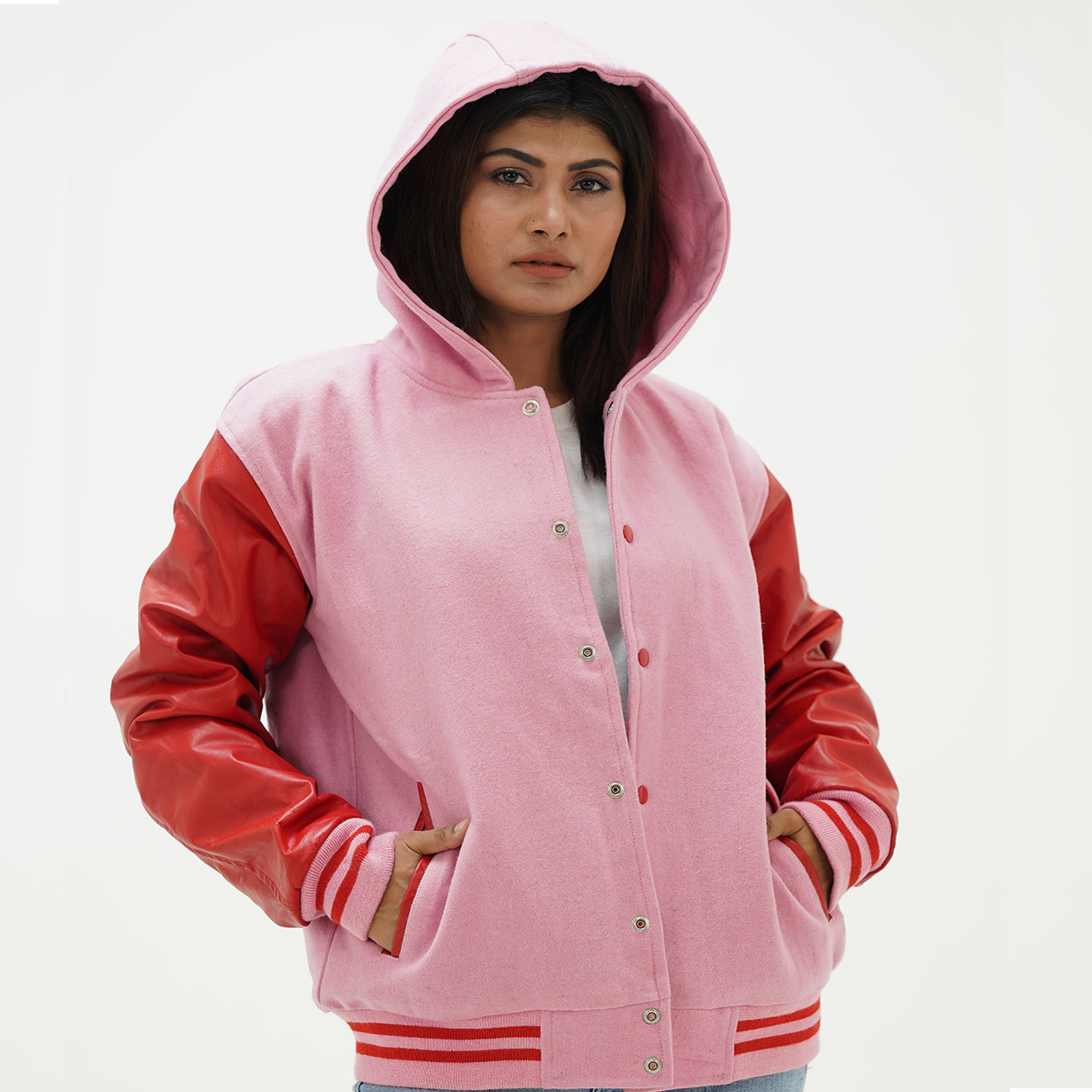 Pink wool letterman jacket with hood and red leather sleeves front view featuring snap button closure and drawstring hood