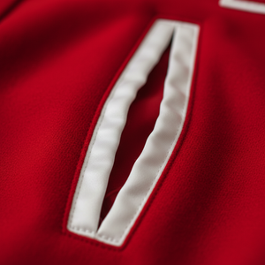 Close-up of a red sports jersey with white accents