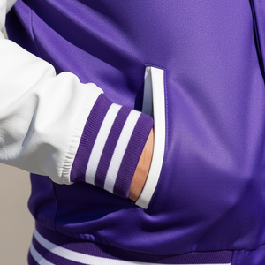Close-up of a purple jacket with white stripes on a neutral background