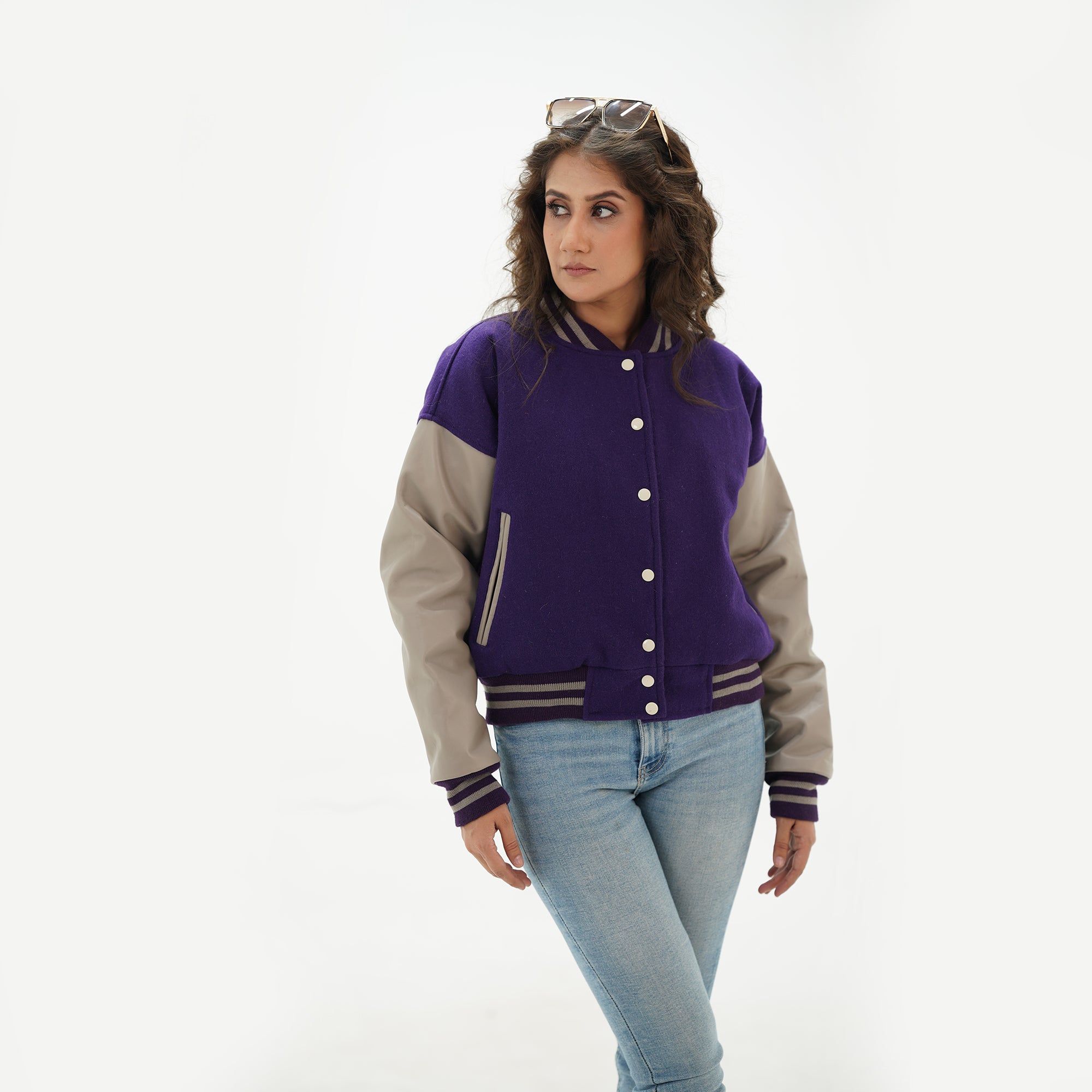 Full display of girls purple and gray crop varsity jacket showing complete cropped fit, leather arms, wool body, and modern letterman style