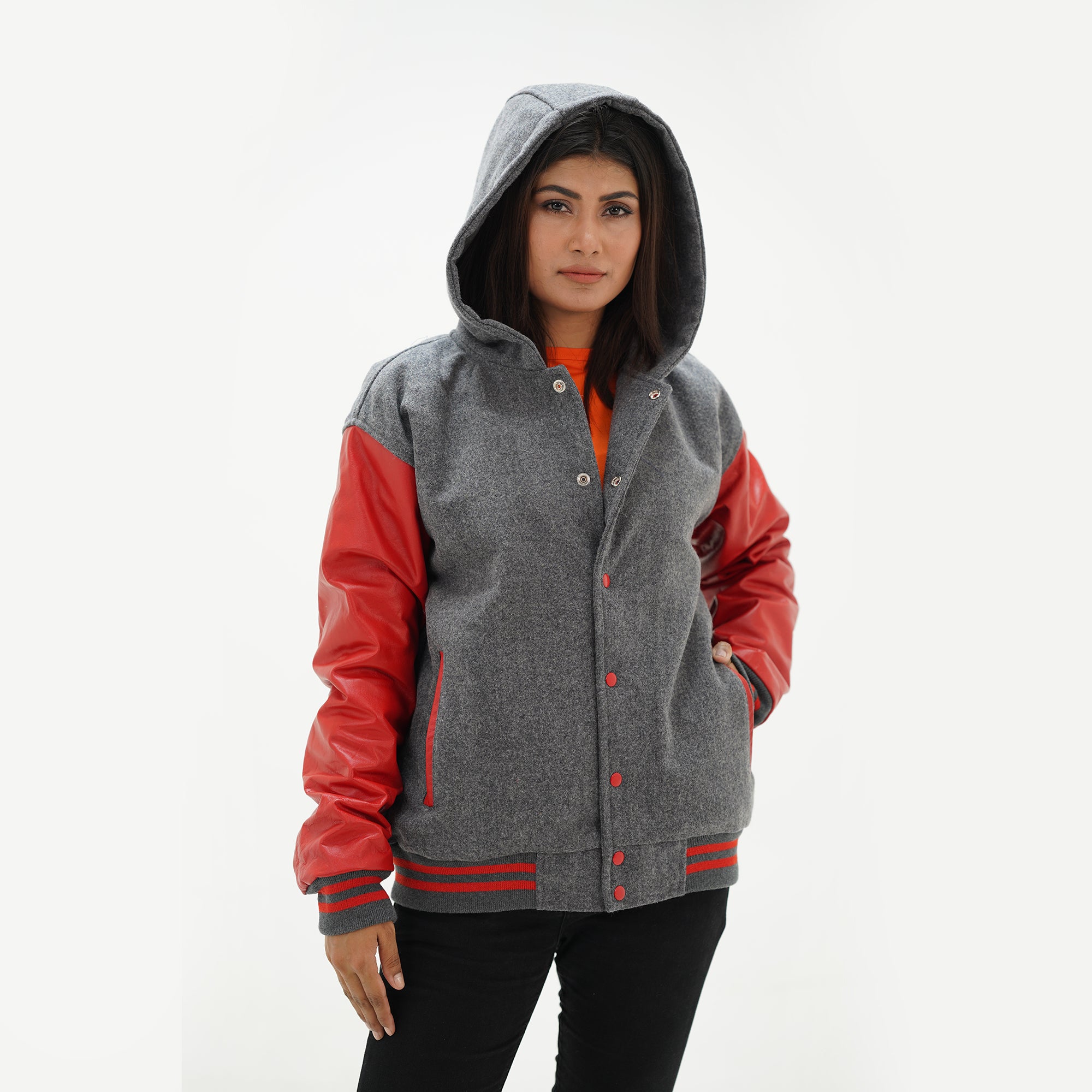Three-quarter angle of red and gray letterman jacket with red leather sleeves and wool body construction