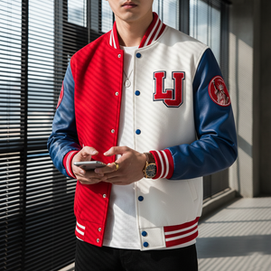 Person wearing a red, white, and blue letterman jacket with 'LJ' logo, holding a phone.
