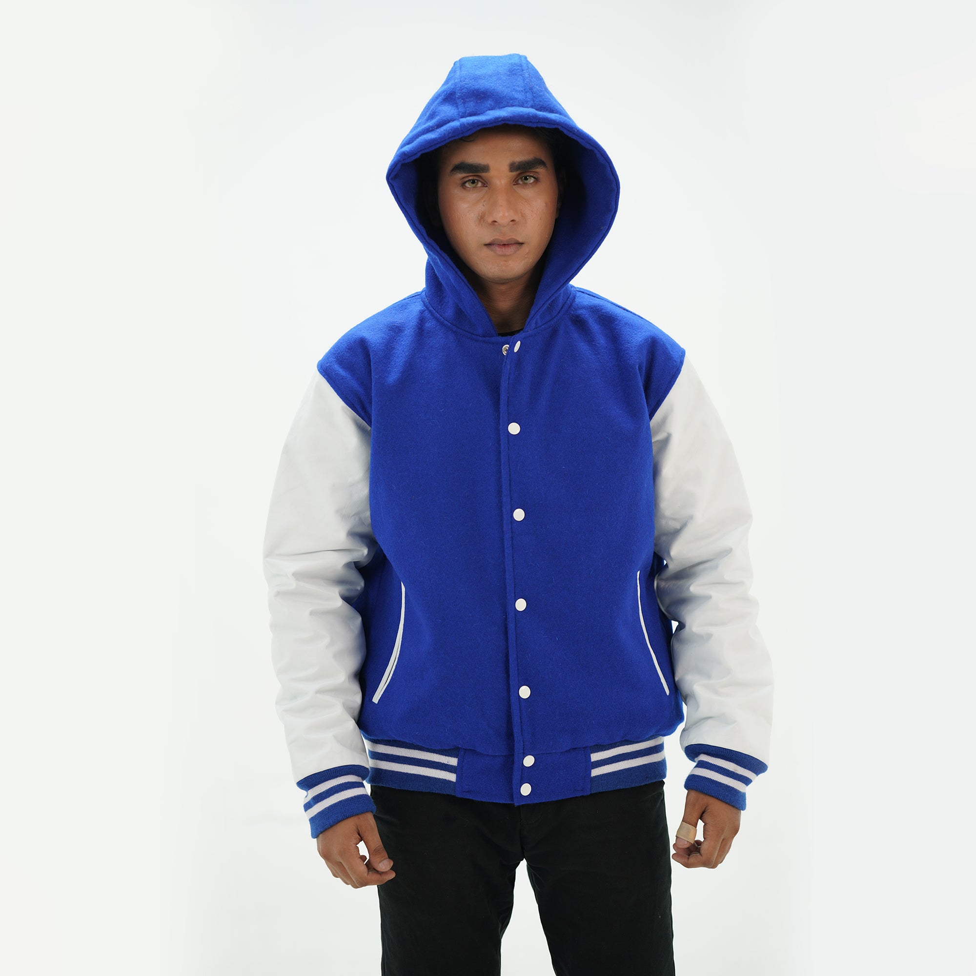 Front view of men's royal blue and white hooded letterman jacket featuring wool body leather sleeves and custom embroidery options