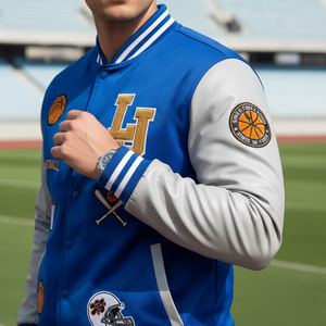 Blue and gray varsity jacket with logos on a sports field background