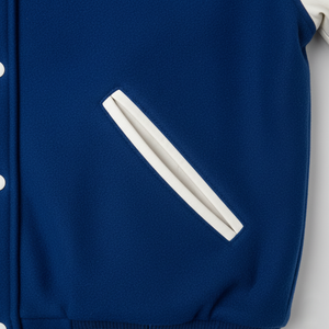Blue jacket with a white trims on a white background
