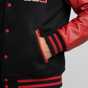 Black varsity jacket with red accents on a plain background
