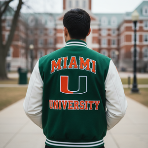 Person wearing a green 'MIAMI UNIVERSITY' letterman jacket on a campus setting.