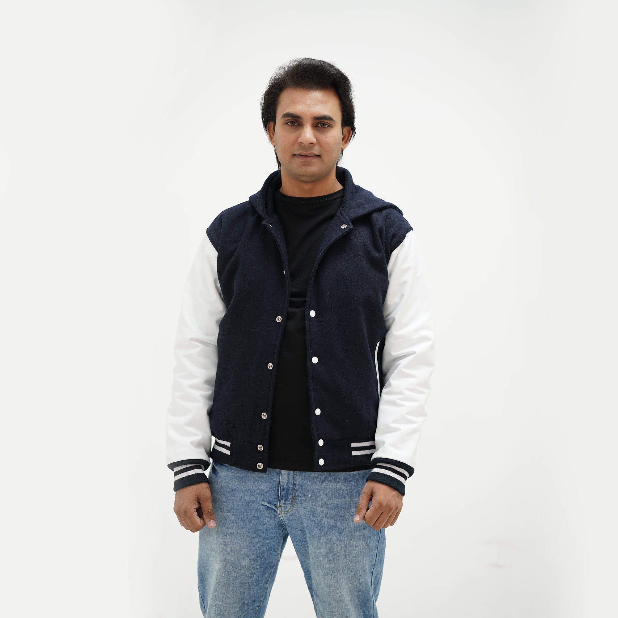 Close-up detail of dark blue and white varsity jacket with hood wool body and leather sleeves premium quality materials