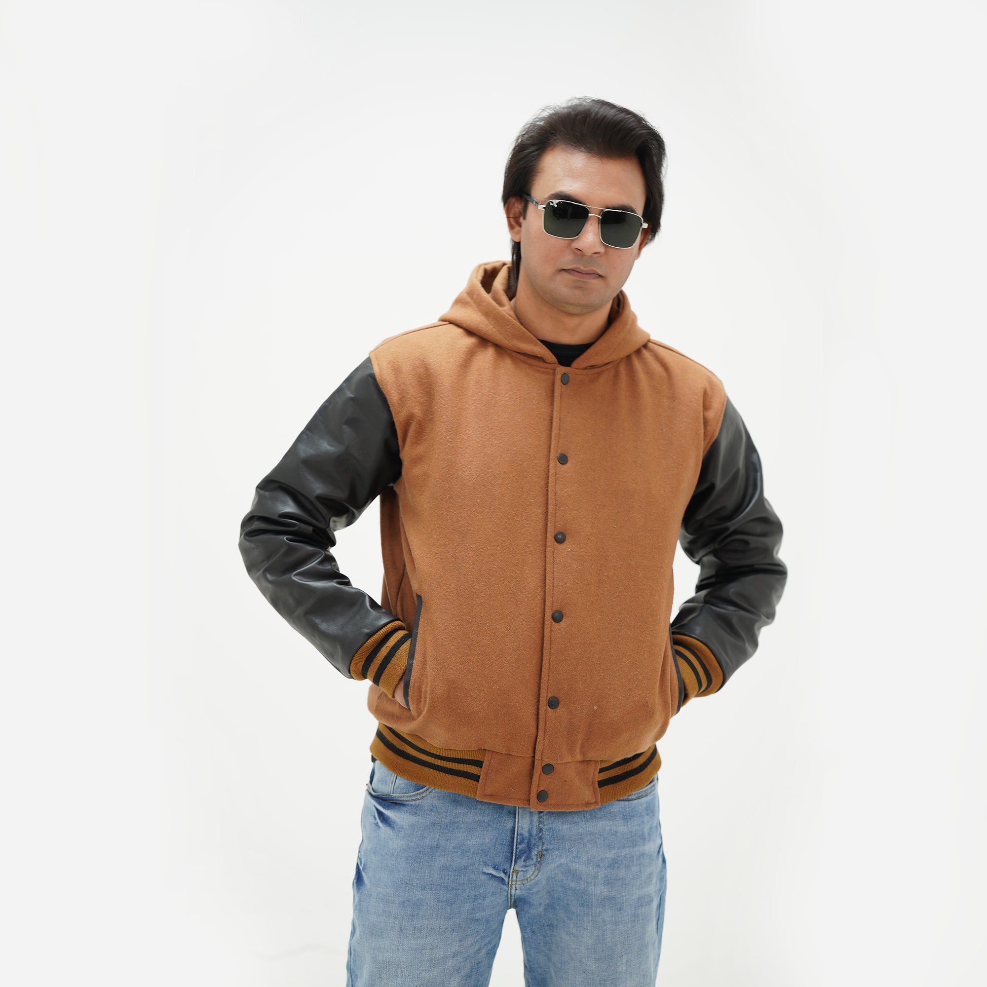 Close-up detail of varsity jacket with hoodie wool body and leather sleeves perfect for campus life and game days