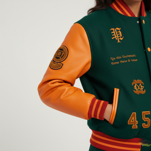Green and orange varsity jacket with text and logos on a plain background