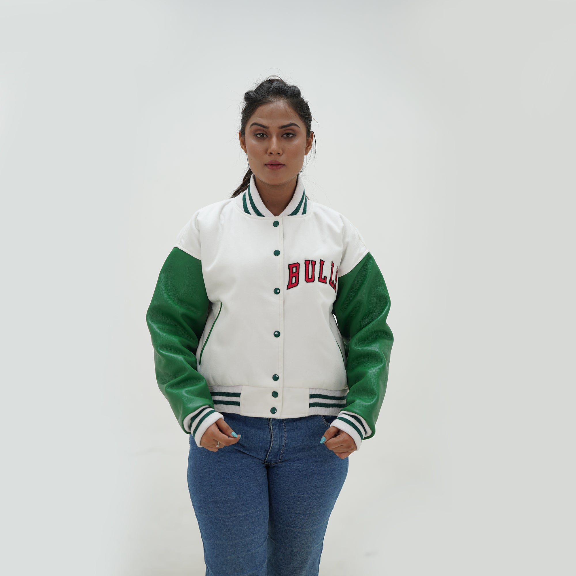 Close up view of women Chicago Bulls letterman jacket collar and ribbed trim details with white wool and green leather styling