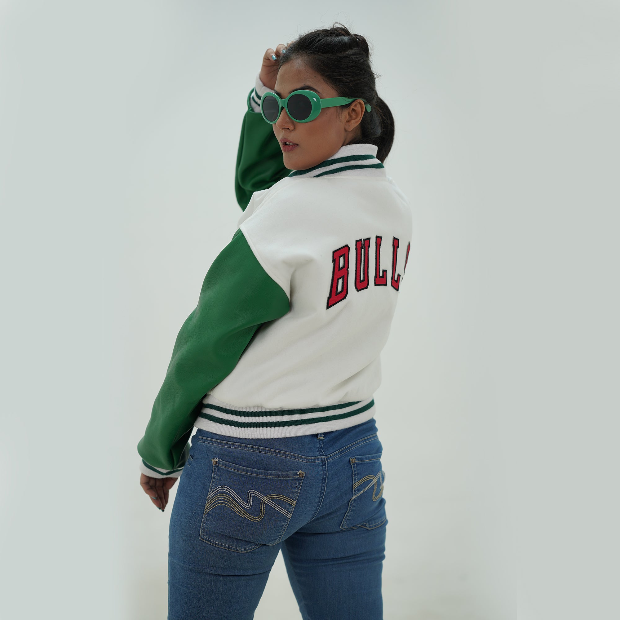Back view of women Chicago Bulls varsity jacket highlighting tailored women fit and premium construction for game day style
