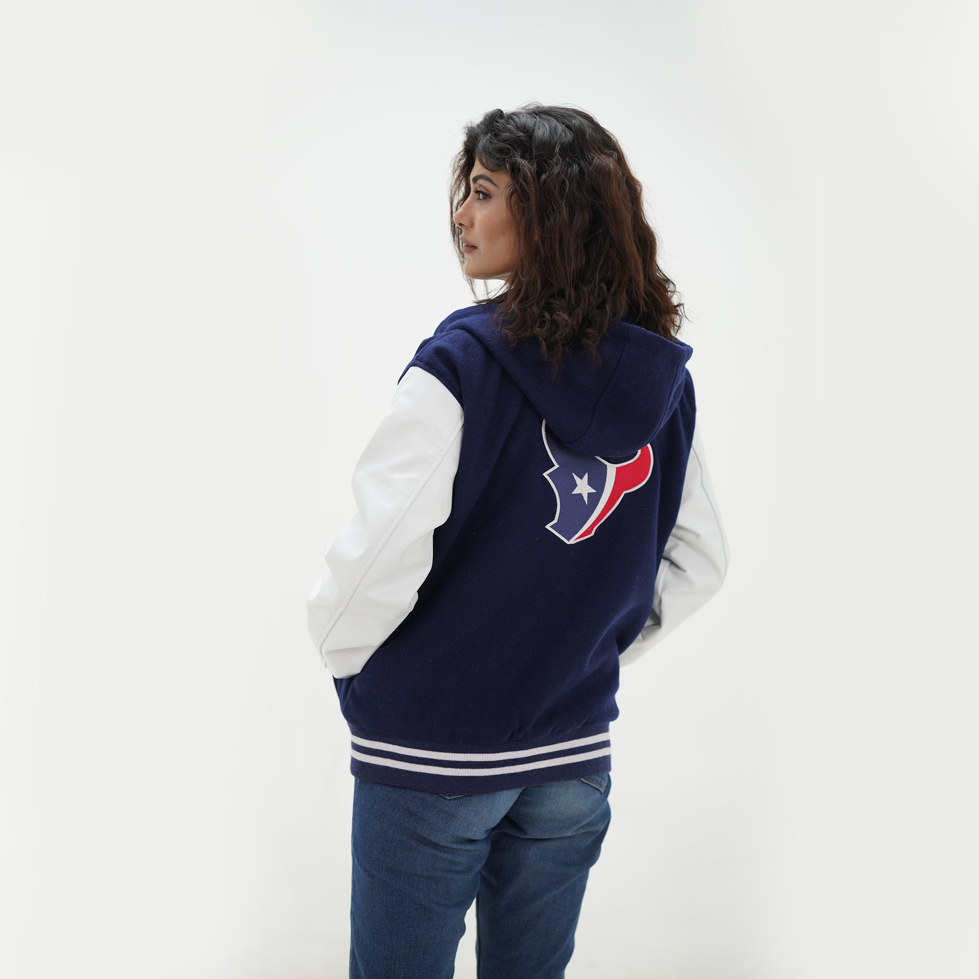 Side angle of women Houston Texans hoodie jacket showcasing white leather sleeves and navy wool body styling for female football fans