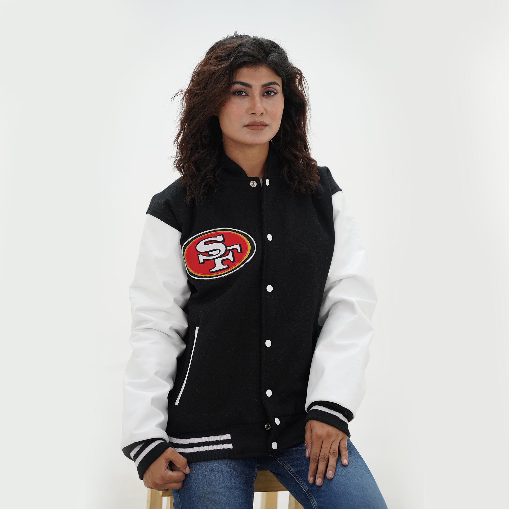 Detail shot of women San Francisco 49ers hoodie showing premium material quality with navy wool body and white leather sleeve craftsmanship